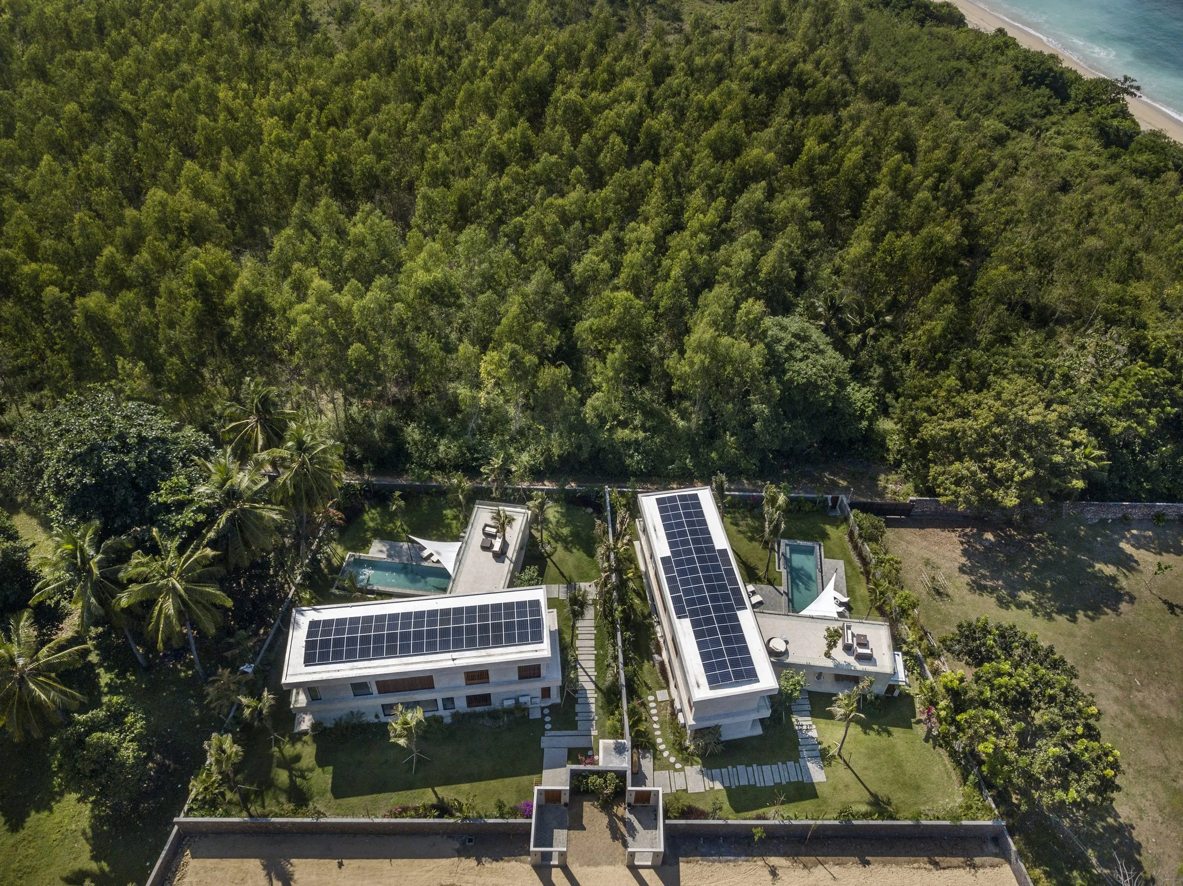 Wave Lombok villas from above, surrounded by palm trees